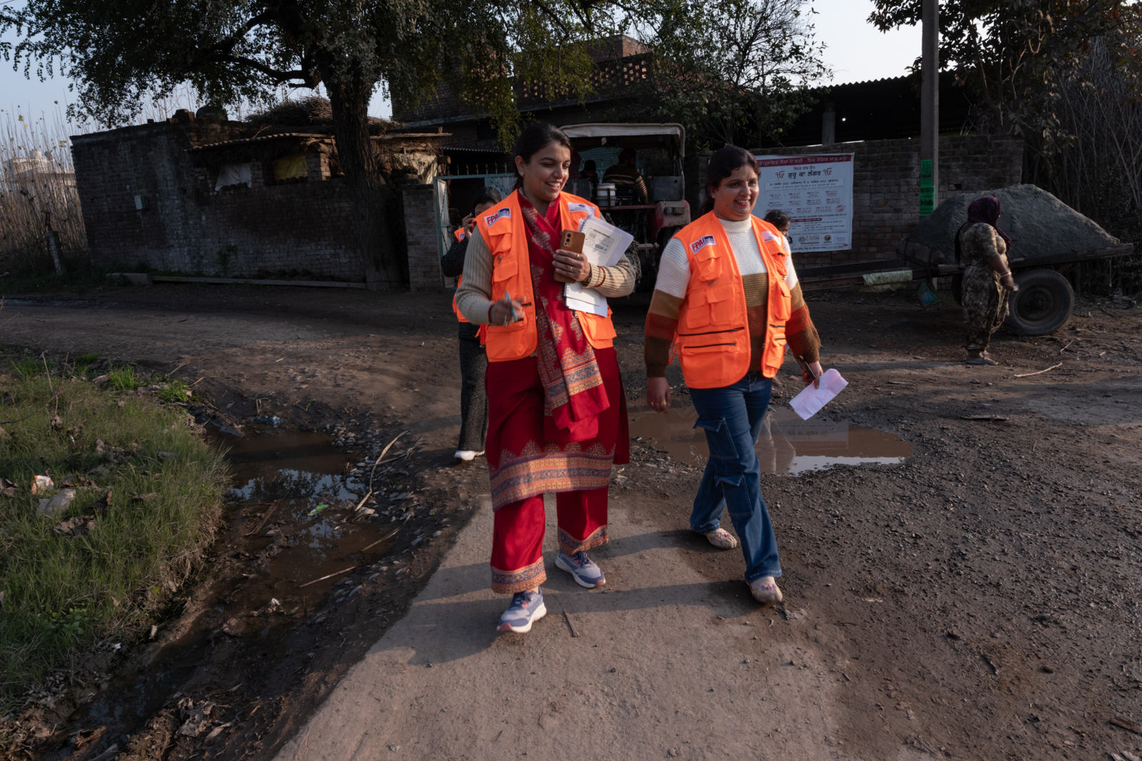 Two humanitarian volunteers walking together. 