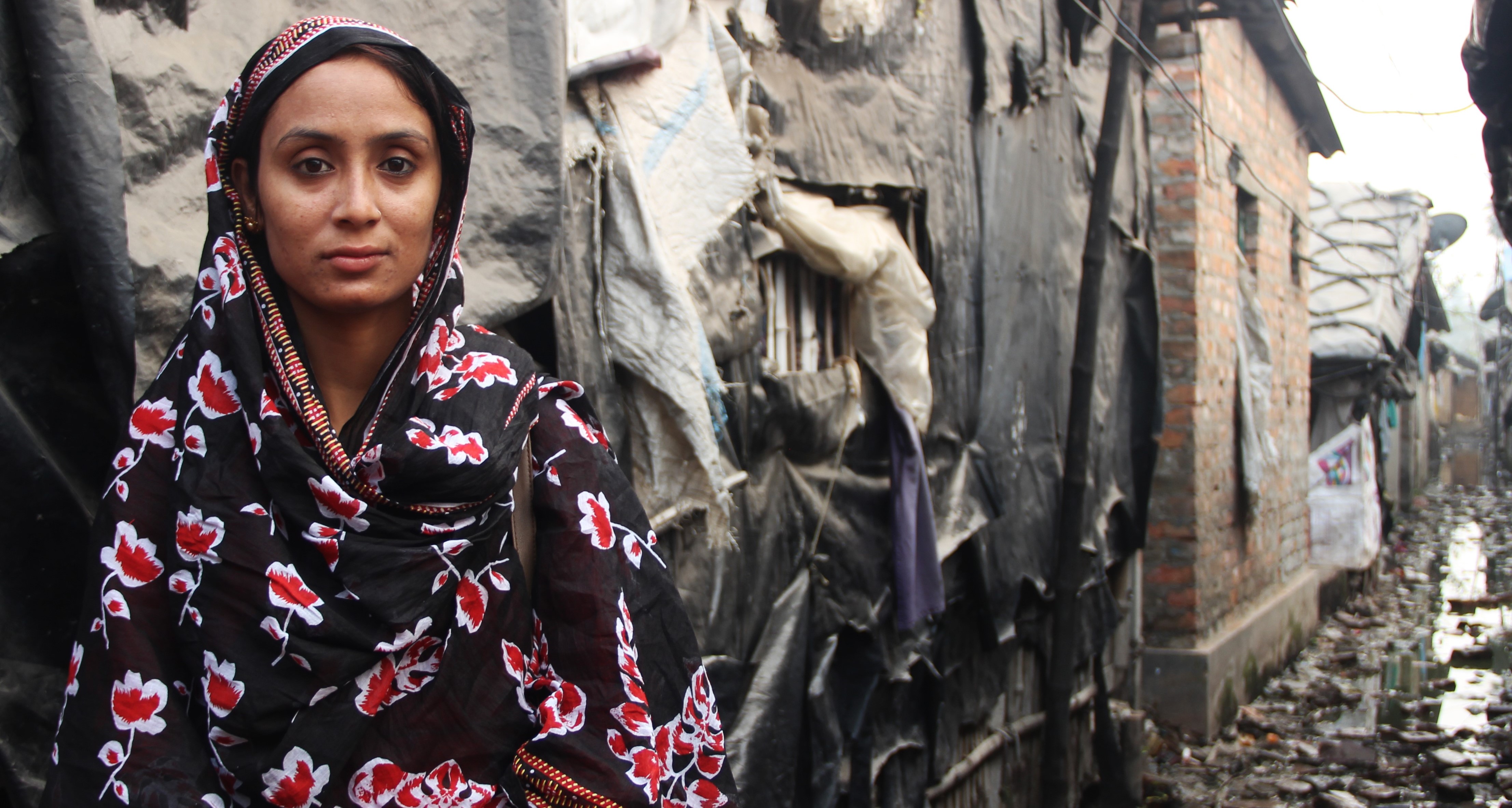 woman in front of her house