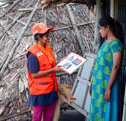A community volunteer counsels her client during a humanitarian response. 