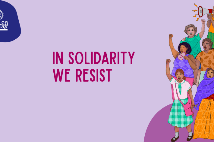 A beige banner with the May 28 logo on top left. On the right is an illustration of people sloganeering. In the middle is pink text that reads: In Solidarity We Resist