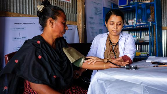 A client at a humanitarian camp receiving a checkup. 