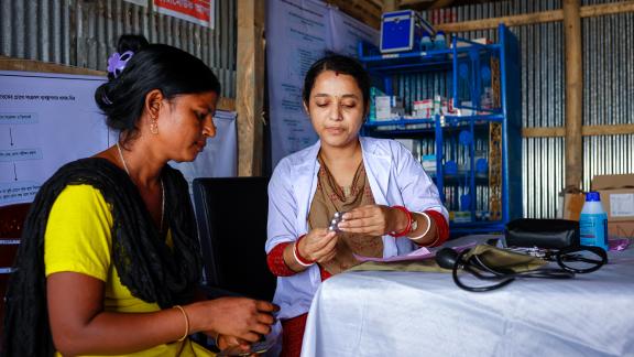 A client at a humanitarian camp receiving a checkup. 
