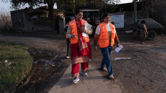 Two humanitarian volunteers walking together. 